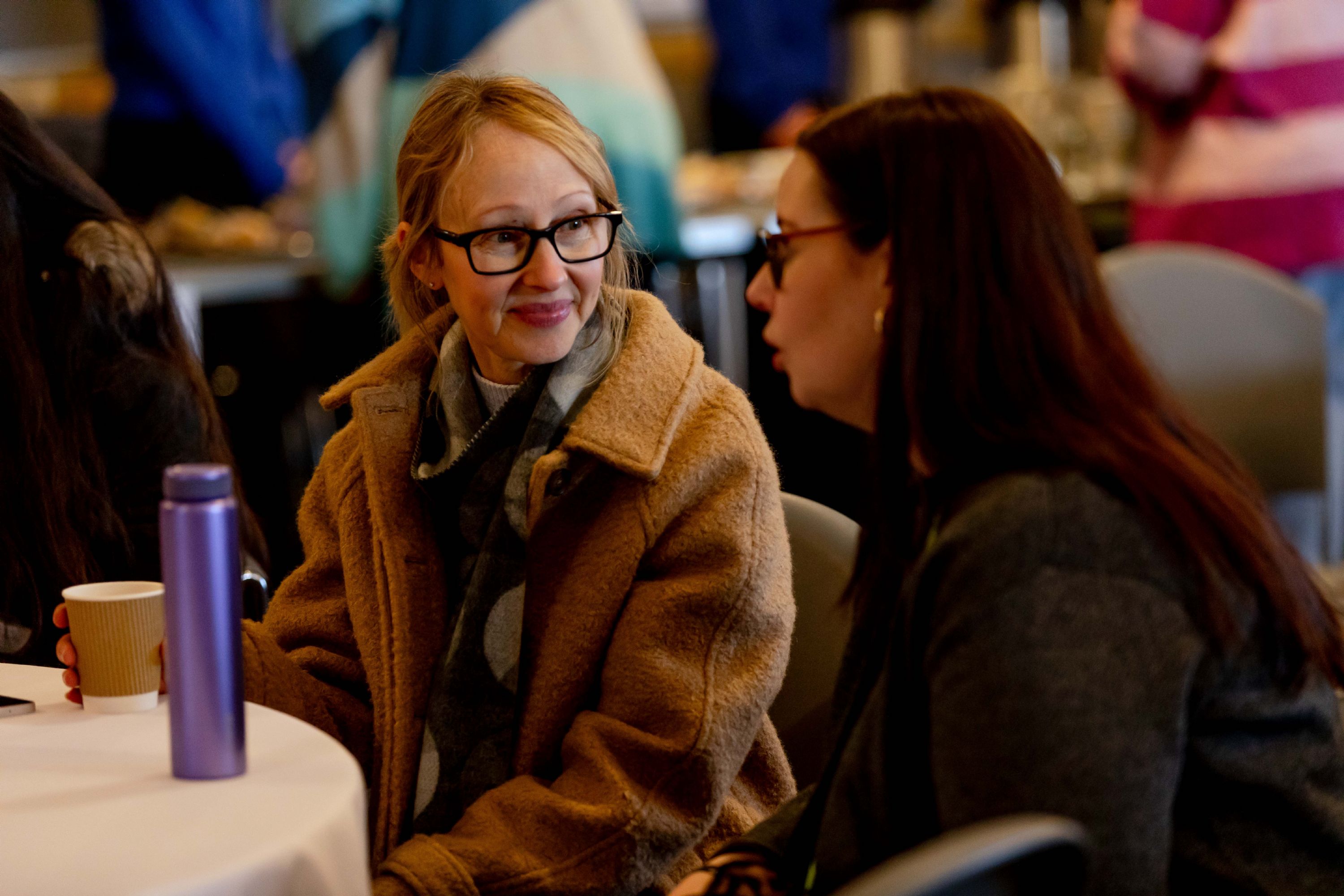 Two women sat down chatting