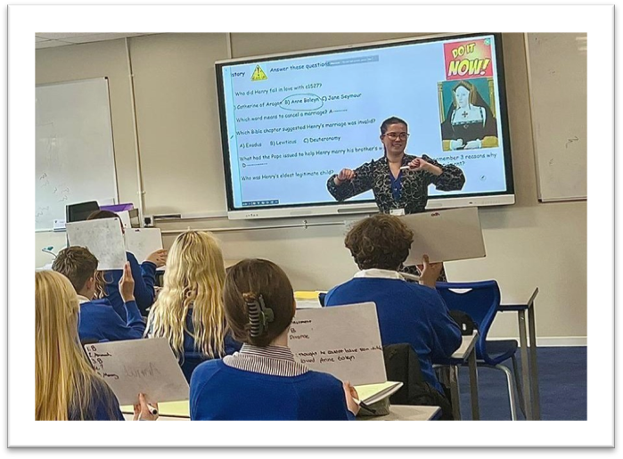 Teacher in classroom with pupils